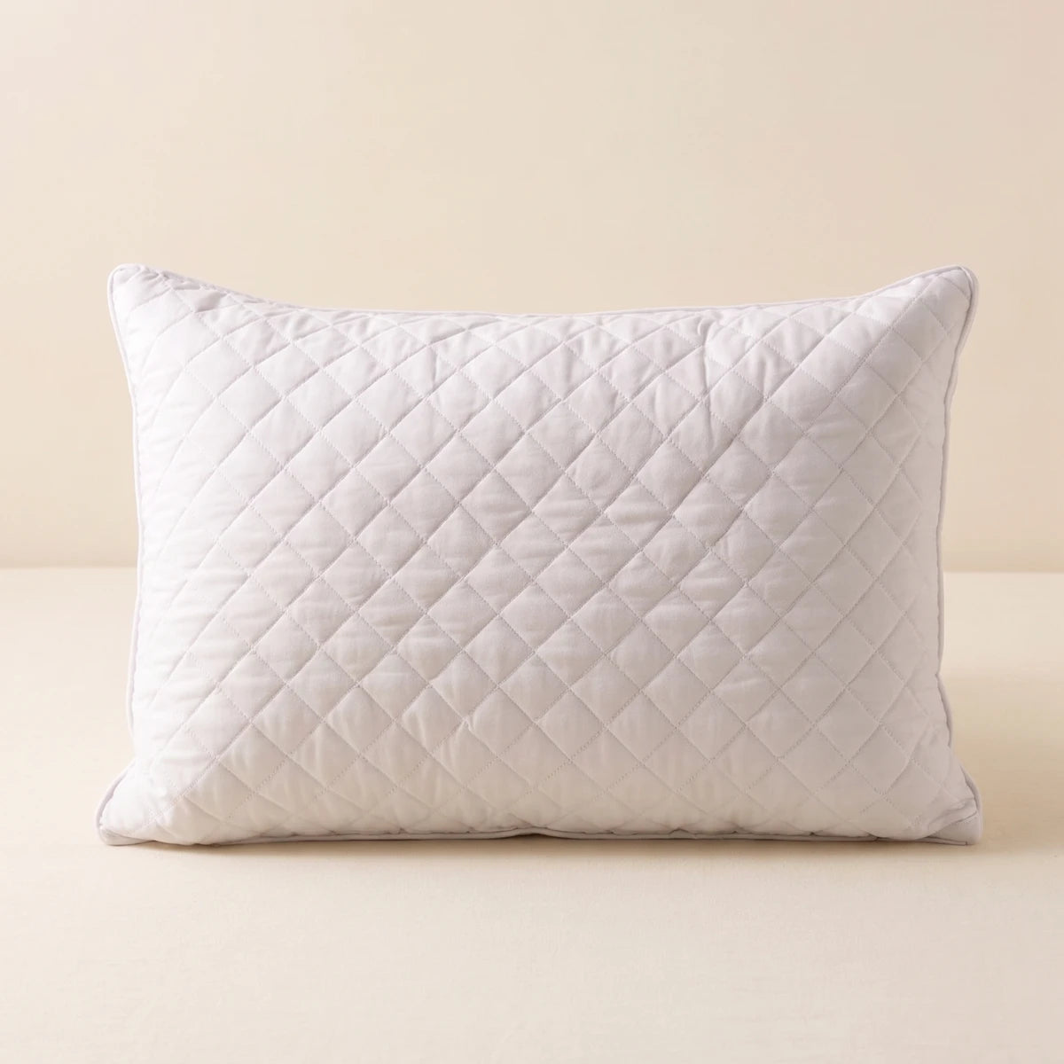 LuxeCotton Quilted Comfort Pillow premium hollow fiber filled pillow with diamond quilted cover on cream background


