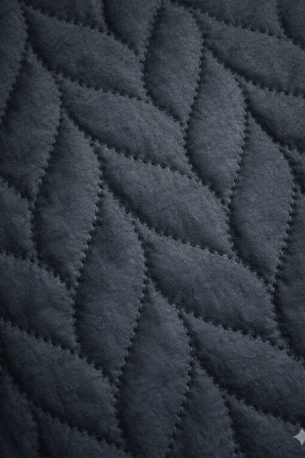 Quilted micro fiber fabric with textured, braided pattern in dark grey