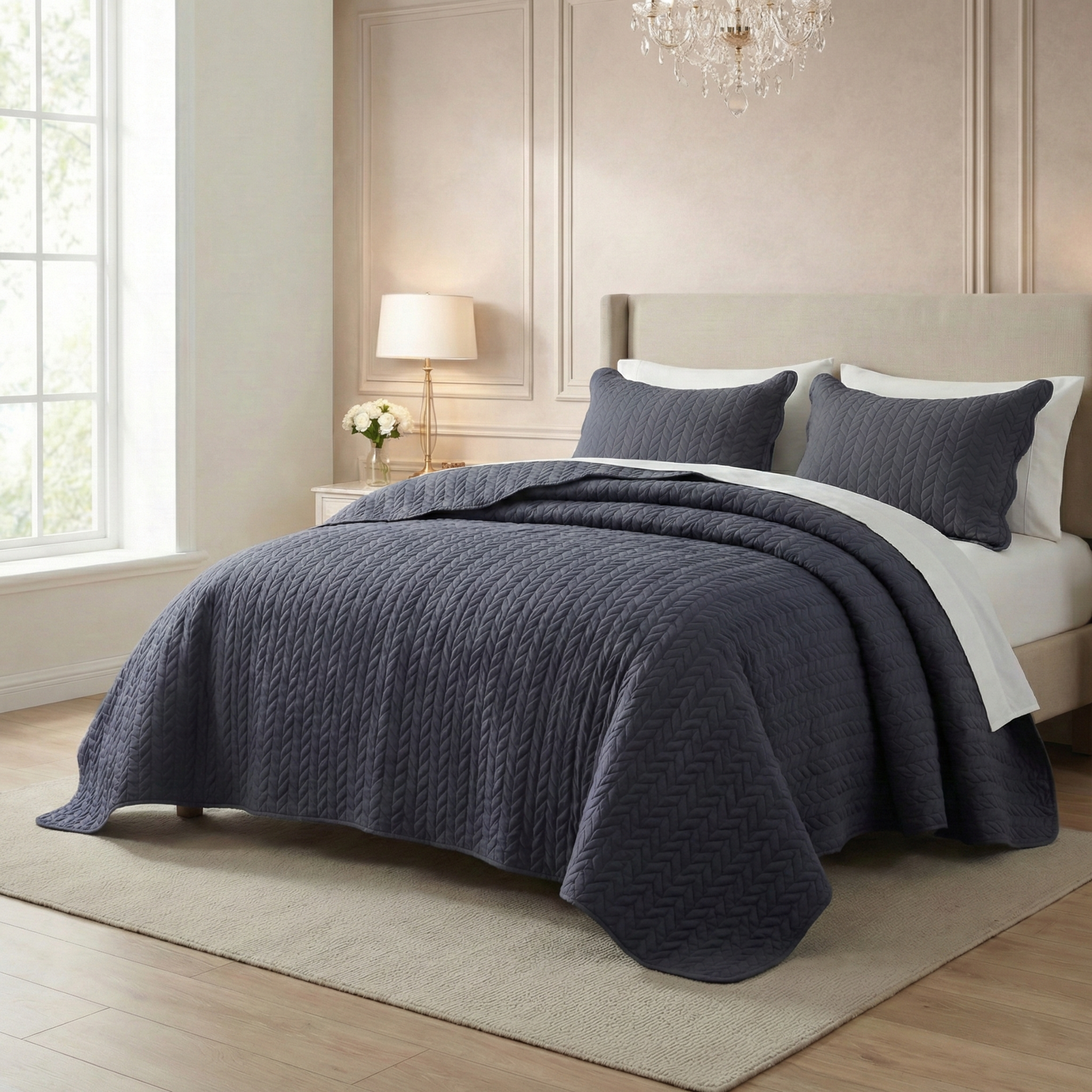 Elegant bedroom with navy quilted bedding set, cream headboard, and soft natural lighting