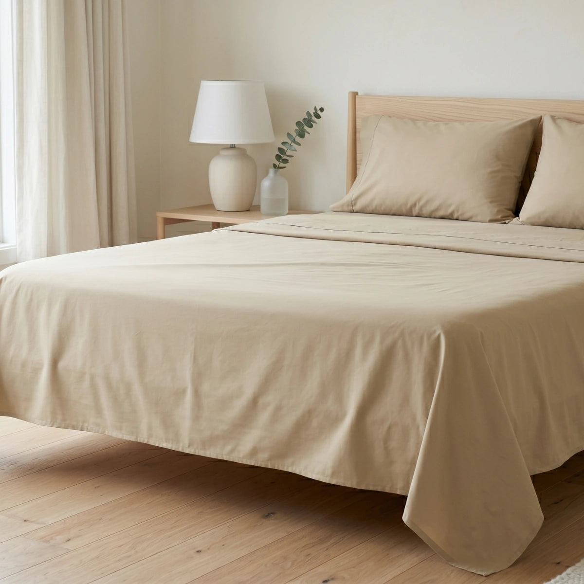 Ivory Sand Beige T200 cotton percale bedsheet set styled on queen bed with ash wood headboard and ceramic lamp by LuxeCotton Pakistan