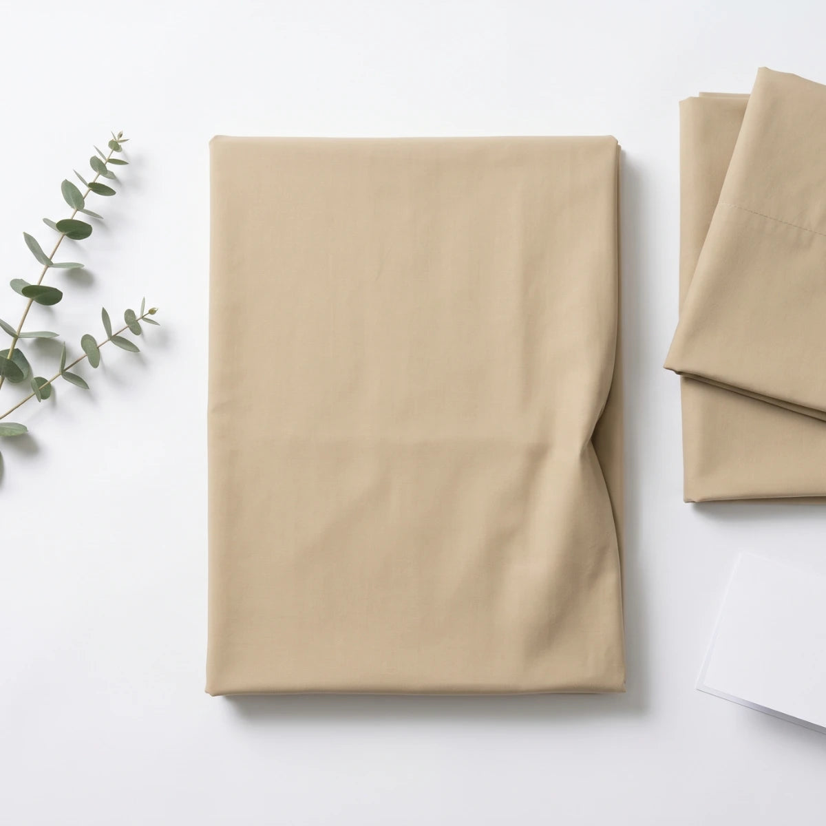 Ivory Sand Beige T200 cotton percale flat bedsheet set folded with eucalyptus by LuxeCotton Pakistan