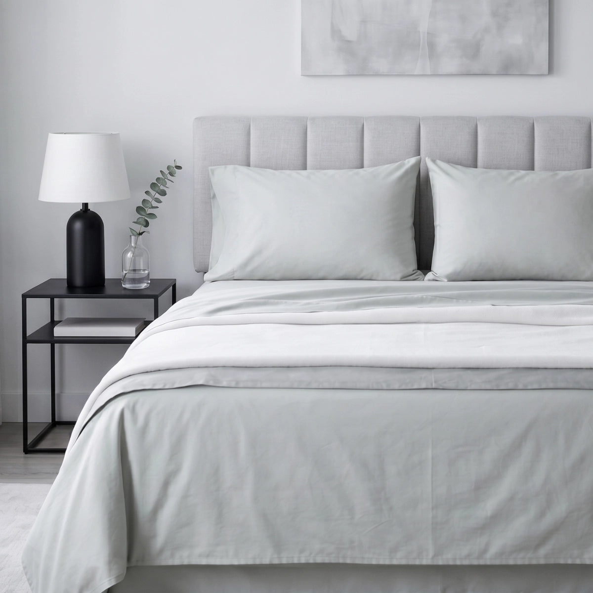 Pearl Mist Grey T200 cotton percale flat bedsheet set styled on queen bed with grey upholstered headboard by LuxeCotton Pakistan